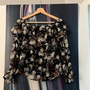 I only wear it one time. It's a cute floral long-sleeve top. The size is XS.